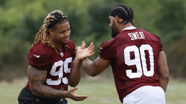 Jul 27, 2023; Ashburn, VA, USA; Washington Commanders defensive end Chase Young (99) and Commanders defensive end Montez Sweat (90) do extra work after morning practice during day two of Commanders training camp at OrthoVirginia Training Center.